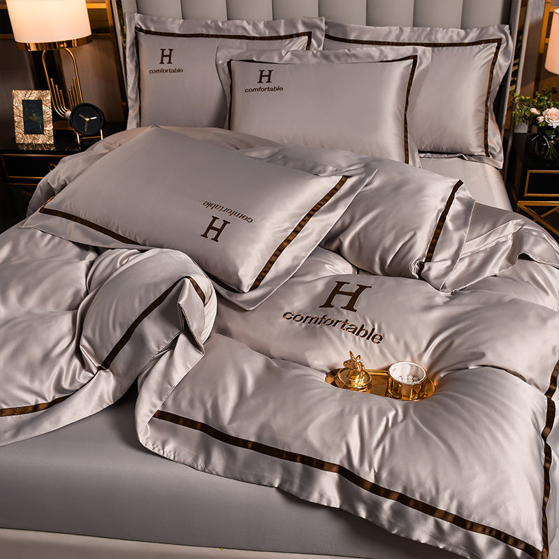 Ensemble de quatre draps de lit en soie glacée simple et tendance pour la maison