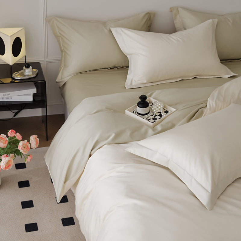 Parure de lit quatre pièces en laine et coton, draps en pur coton