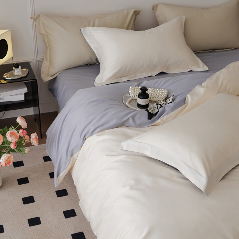 Parure de lit quatre pièces en laine et coton, draps en pur coton