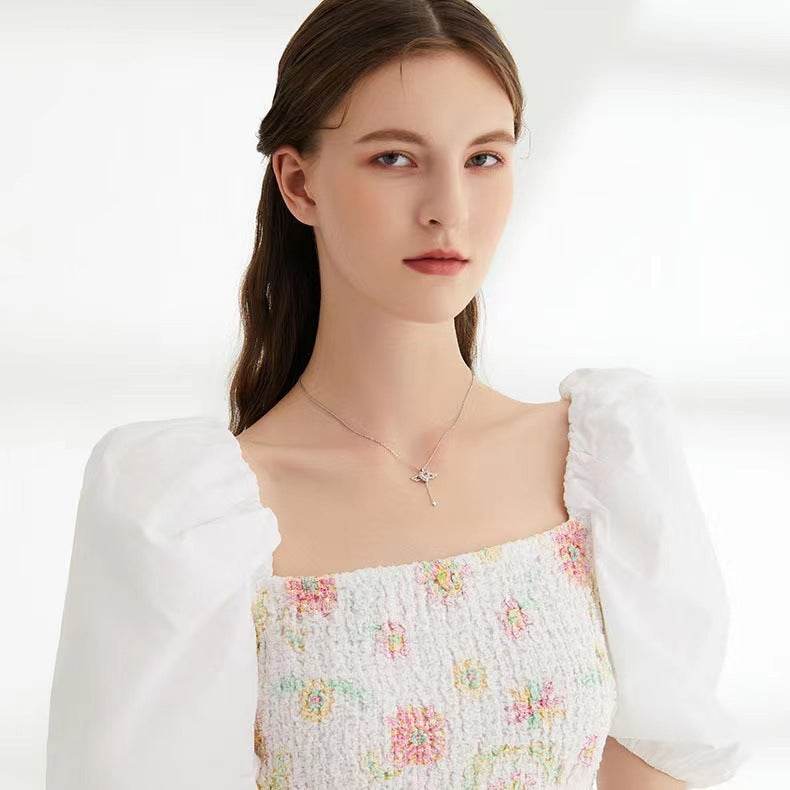 Collier à pompon en forme de cœur et d'ailes d'ange - Style & confort