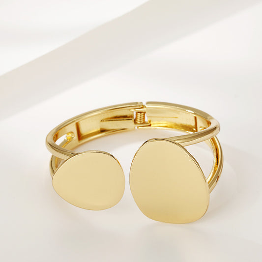 Trendy asymmetrical alloy spring bracelet